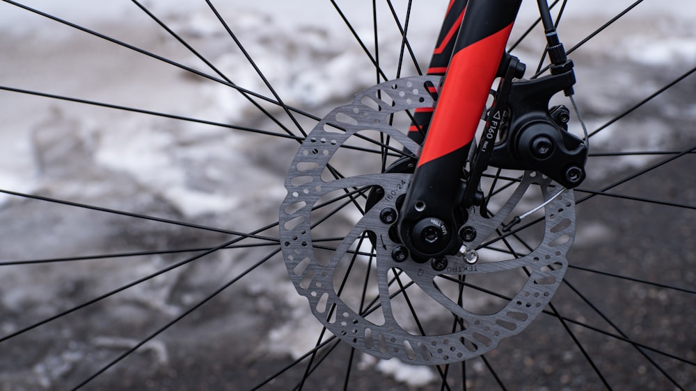 silver and red bicycle wheel