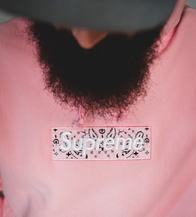 person in pink crew neck shirt