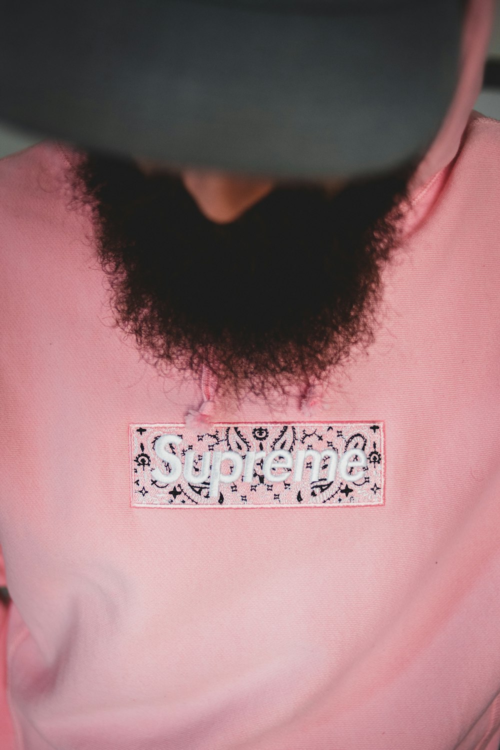 person in pink crew neck shirt