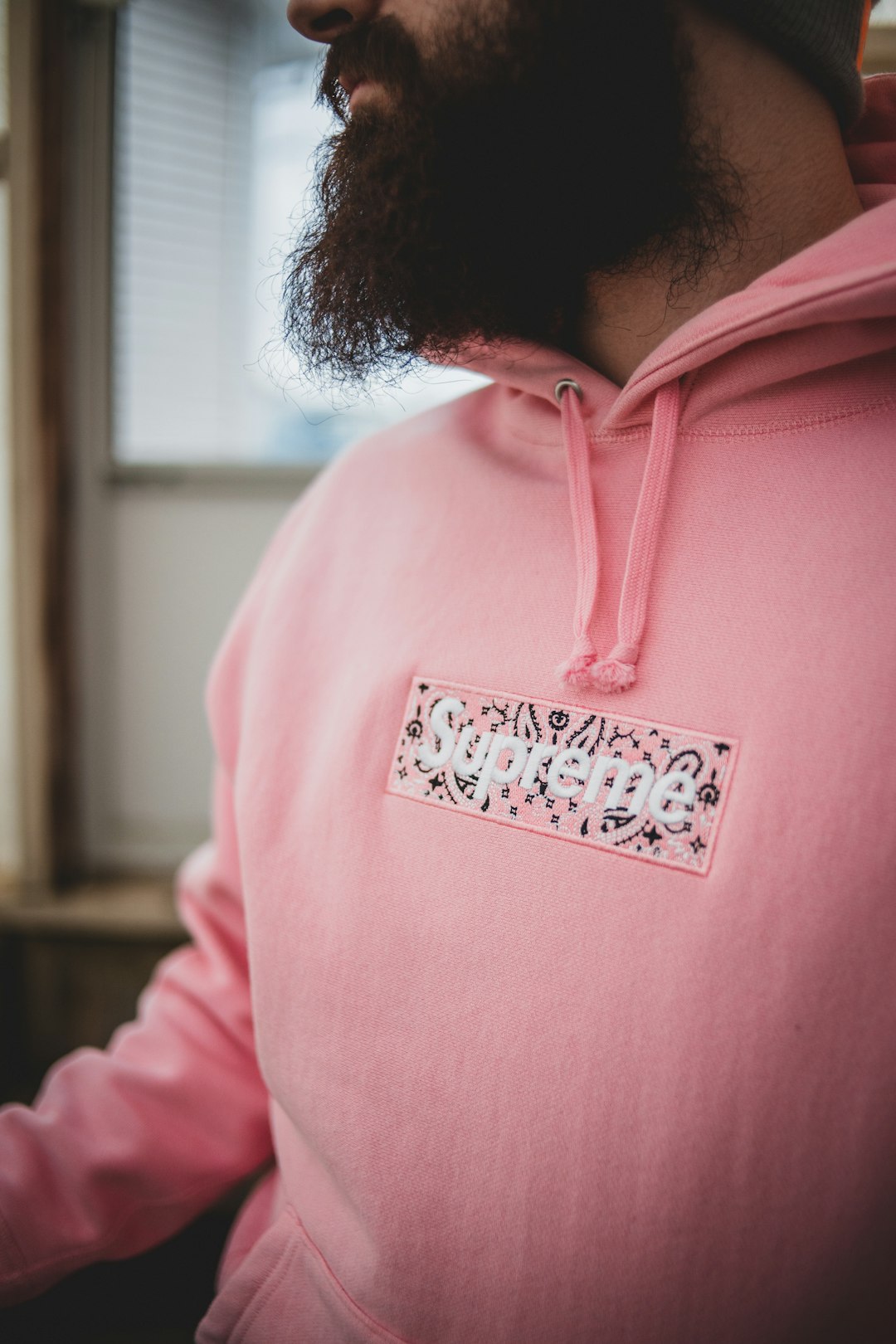 man in pink and white pullover hoodie