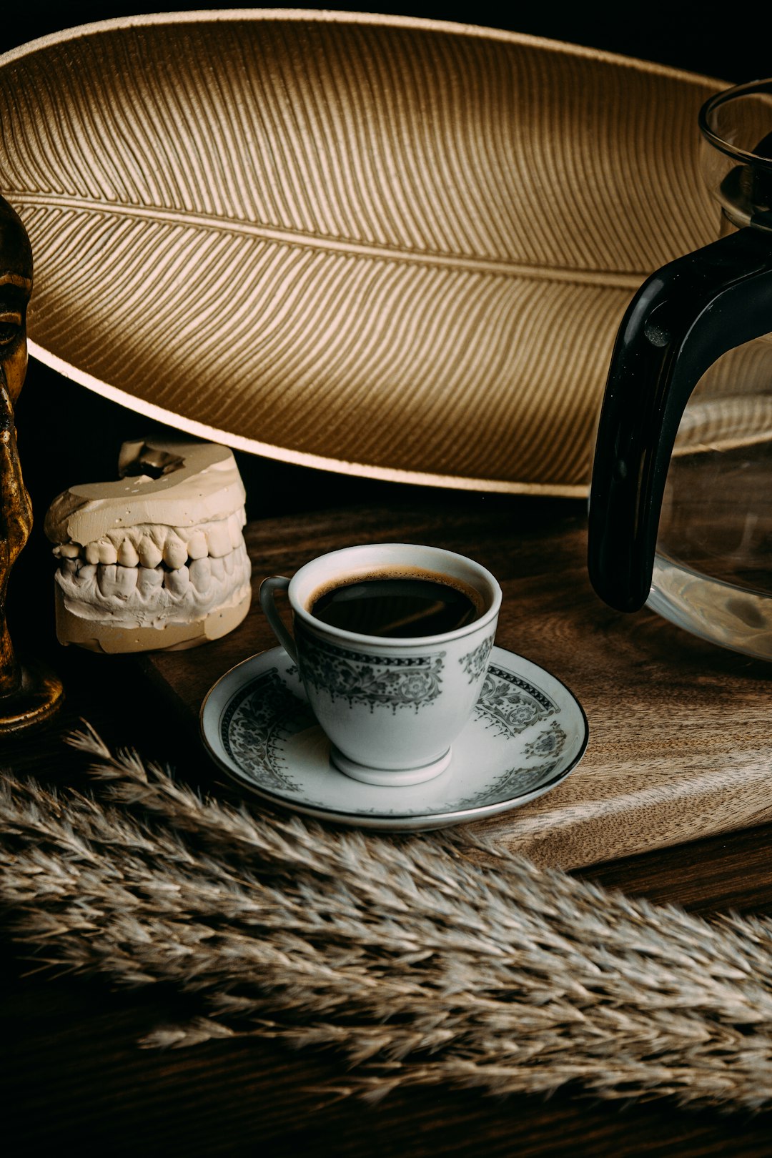 white ceramic cup on saucer