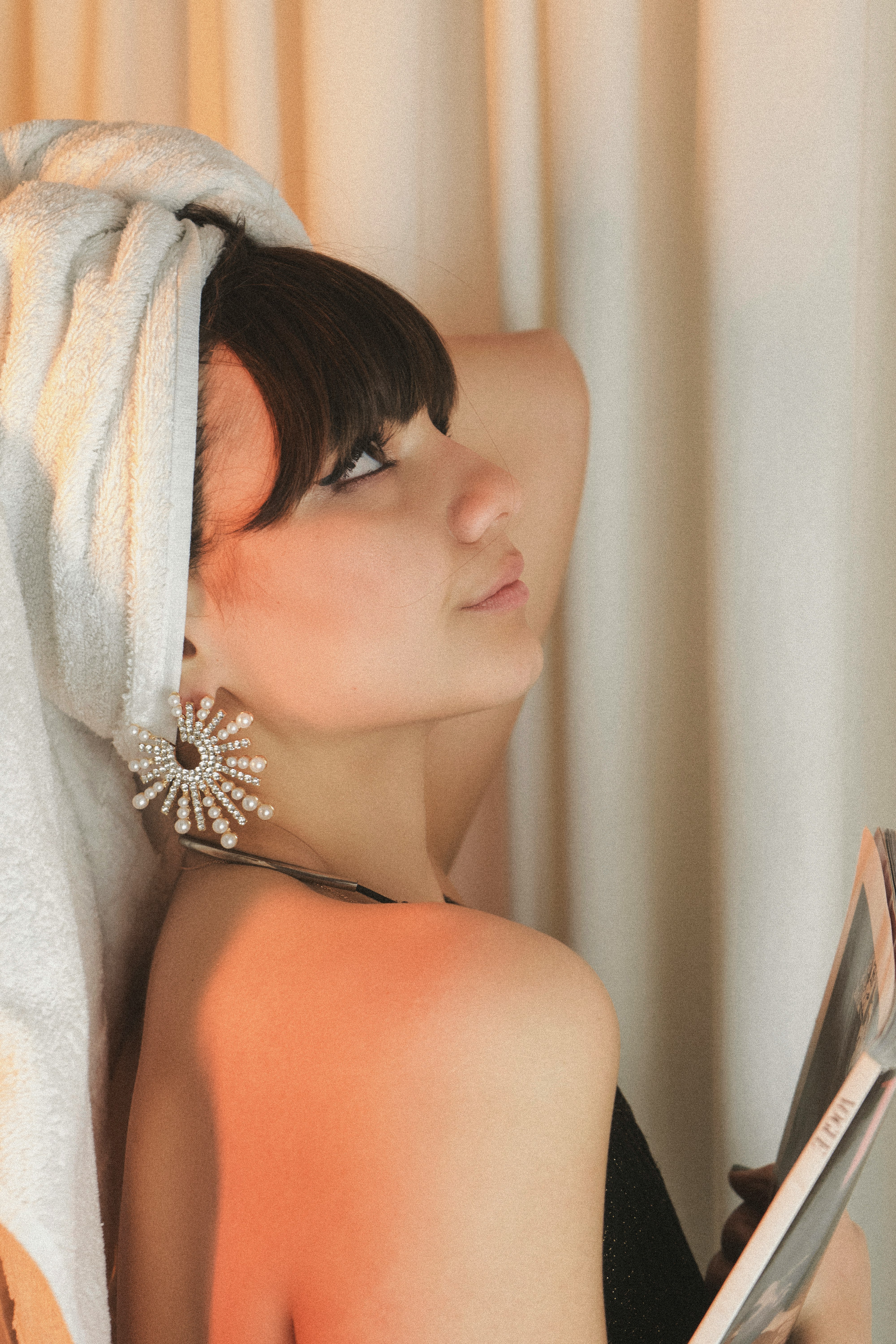 woman in white towel covering her face