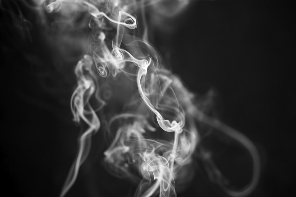 white smoke on black background