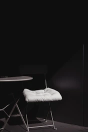 Minimalist luxury furniture piece in a bright room, showcasing clean lines and matte finish.