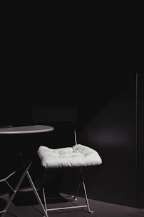 A cozy living room setup featuring a stylish chair and a minimalist table