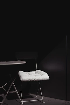 Minimalist luxury furniture piece in a bright room, showcasing clean lines and matte finish.