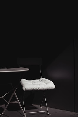 A stylish setup featuring futura chairs and a round table.