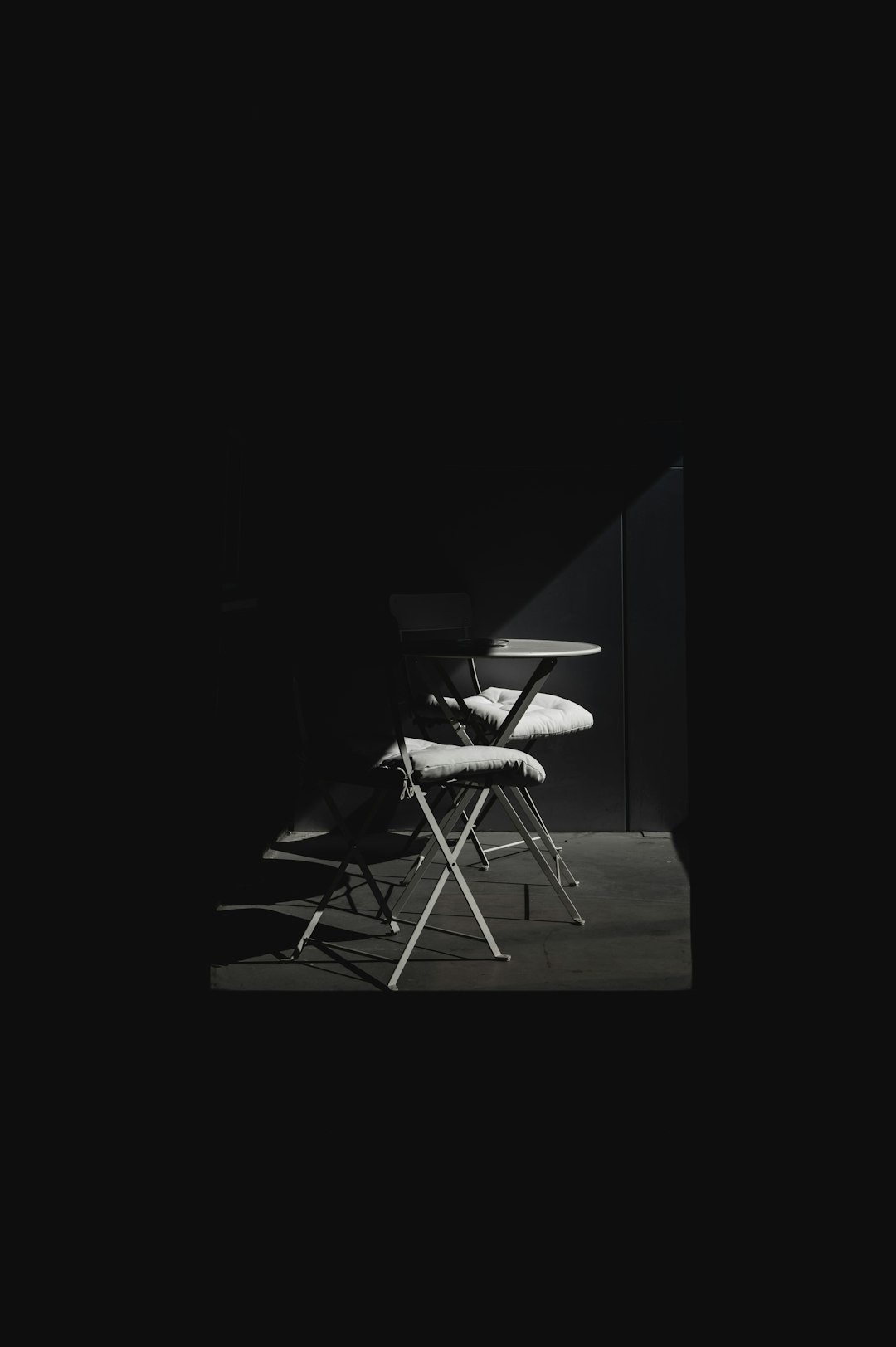 black and white chair on brown wooden table