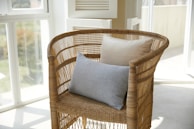 Stylish reupholstered chair with fresh fabric in a bright, airy room.