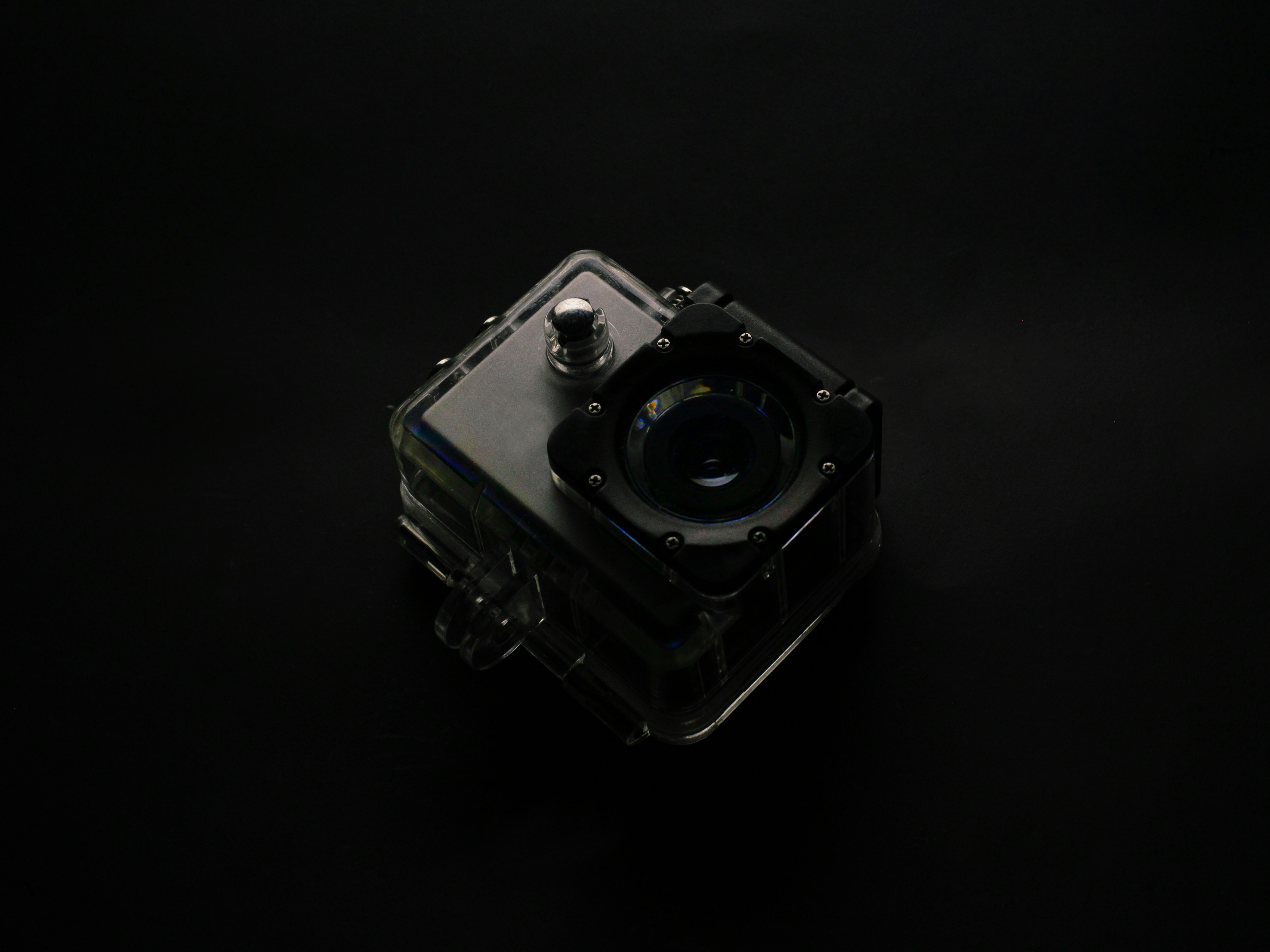 silver and black camera on white surface