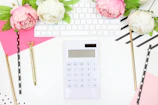 A colorful desk with neatly organized financial documents and a cheerful calculator.