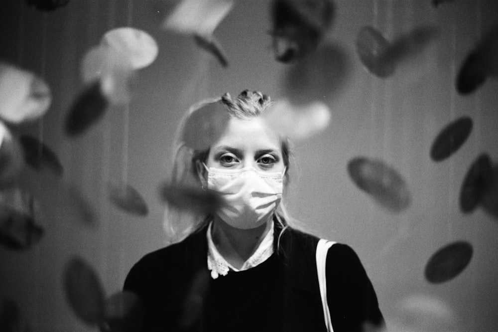 grayscale photo of woman in black and white collared shirt