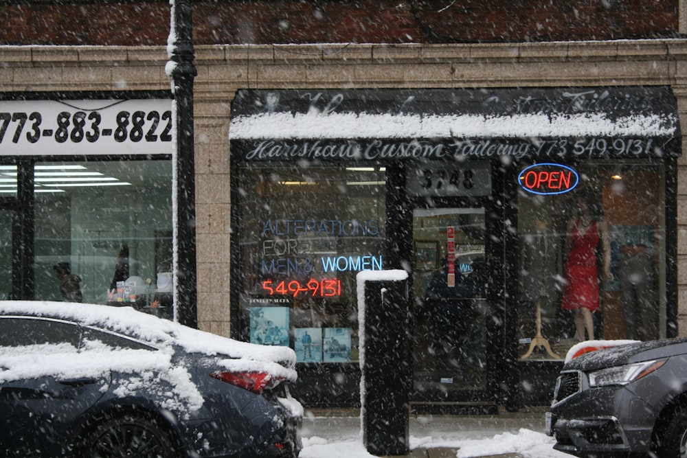 snow covered road near brown brick building during daytime