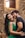 man in black crew neck shirt beside woman in green tank top