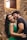 man in black crew neck shirt beside woman in green tank top