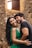 man in black crew neck shirt beside woman in green tank top
