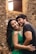 man in black crew neck shirt beside woman in green tank top