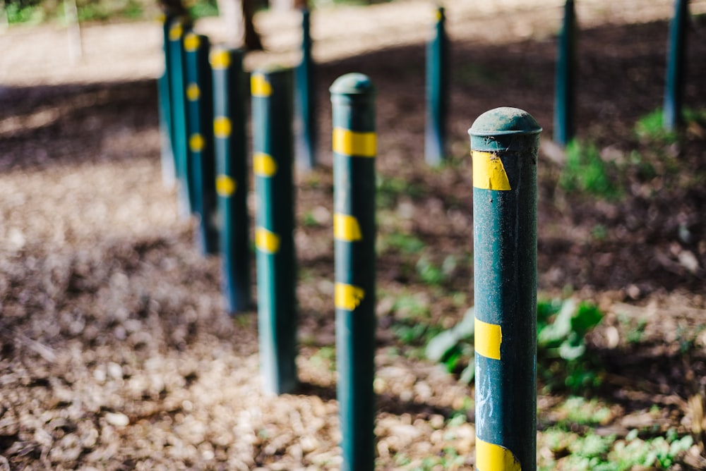 blue metal fence on brown soil