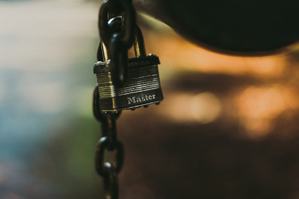 black padlock in black metal chain