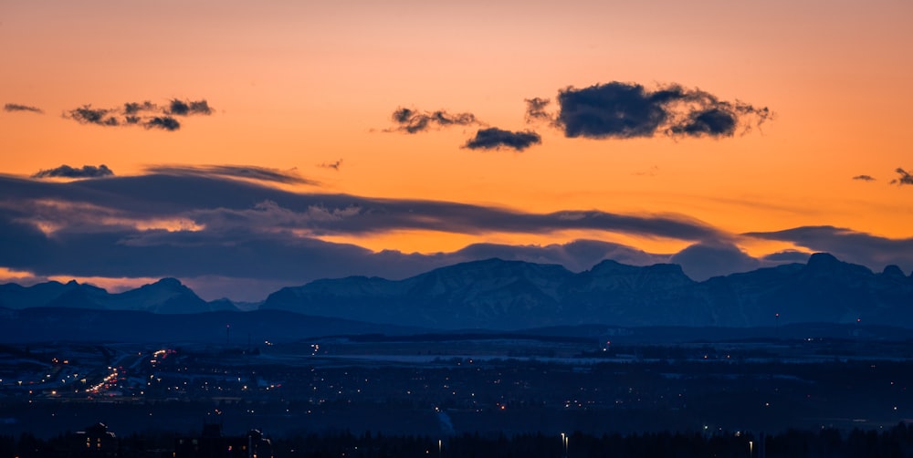 silhouette of mountains during sunset