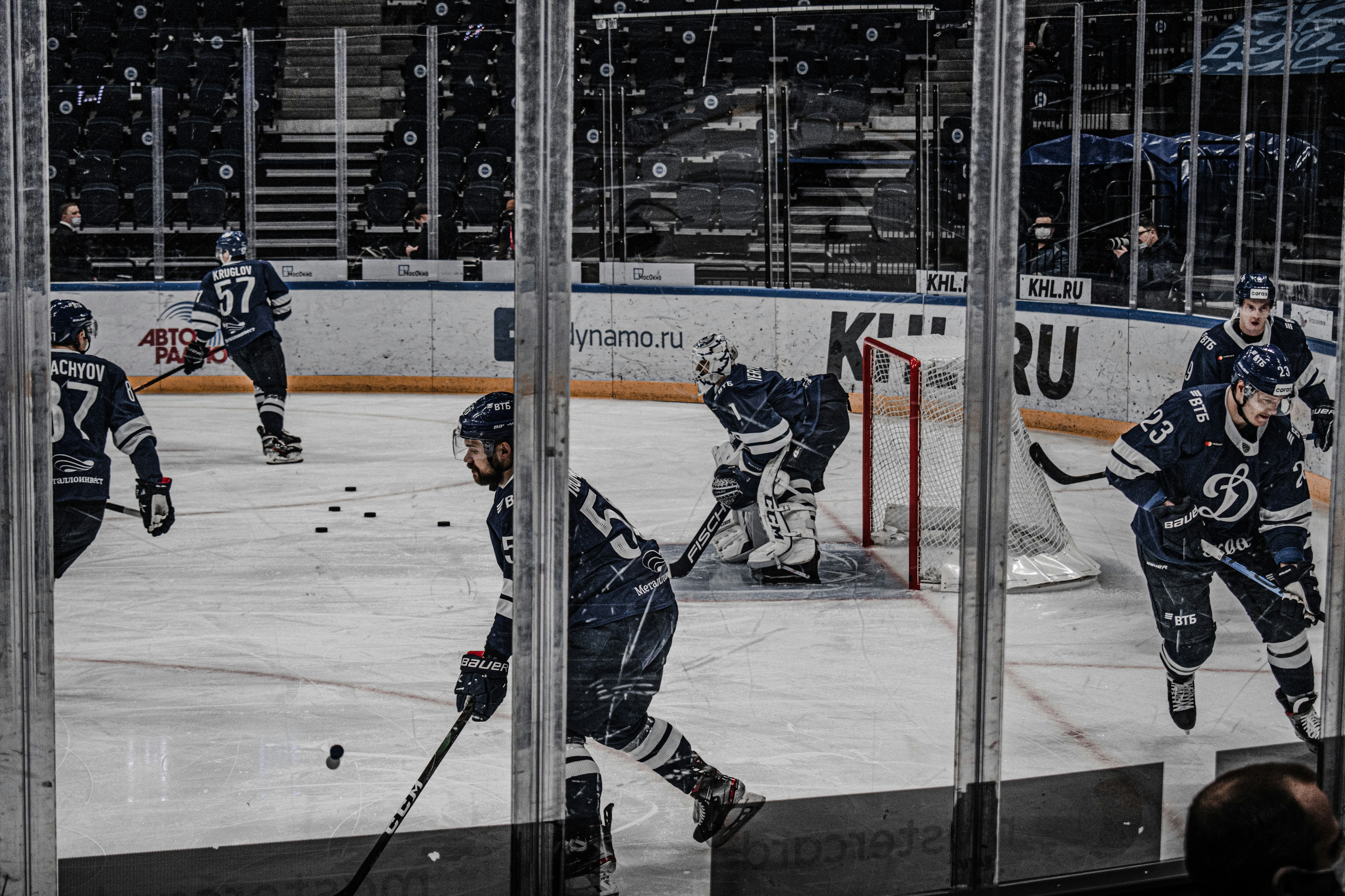 ice hockey players on ice hockey field during daytime