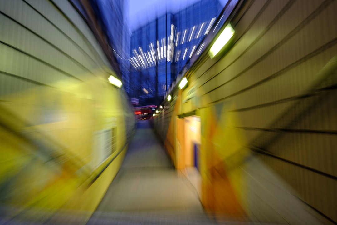 yellow and blue train in tunnel