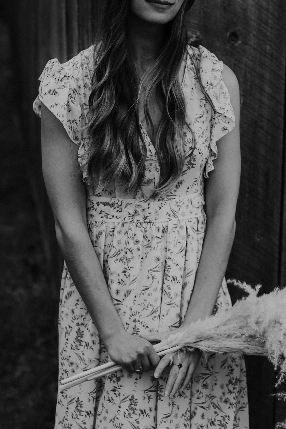 grayscale photo of woman in floral dress