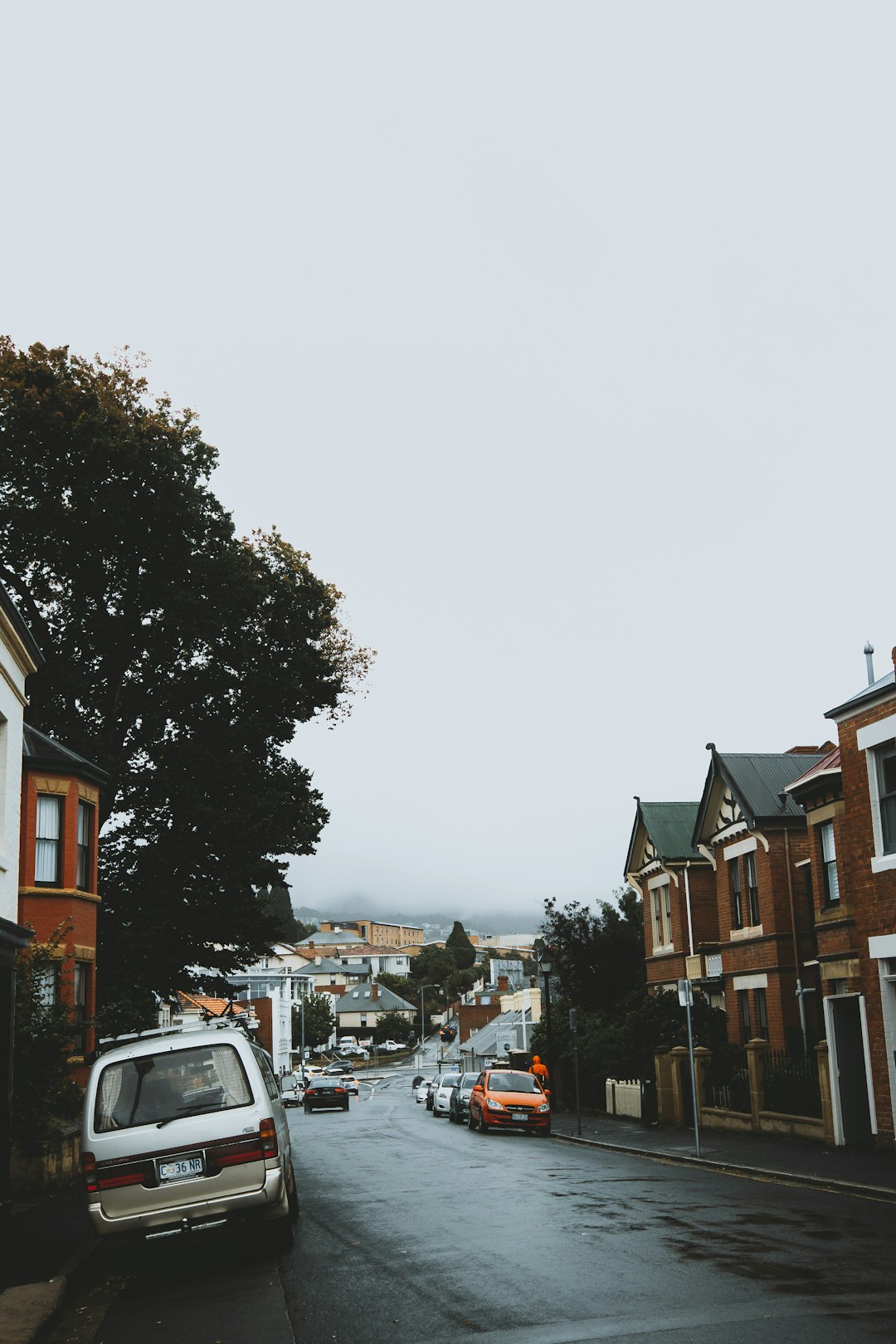 cars parked on side of the road during daytime