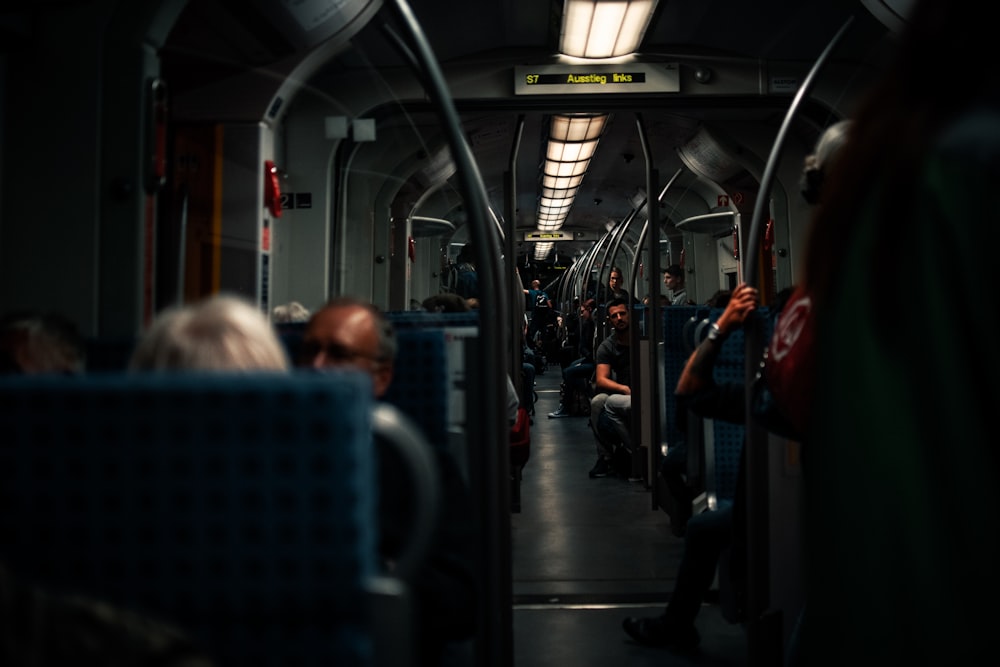 people sitting inside train during daytime