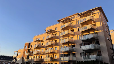 Modern apartment building with balconies in Greater Noida on a sunny day