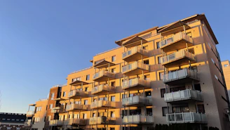 Modern apartment building with balconies in Greater Noida on a sunny day