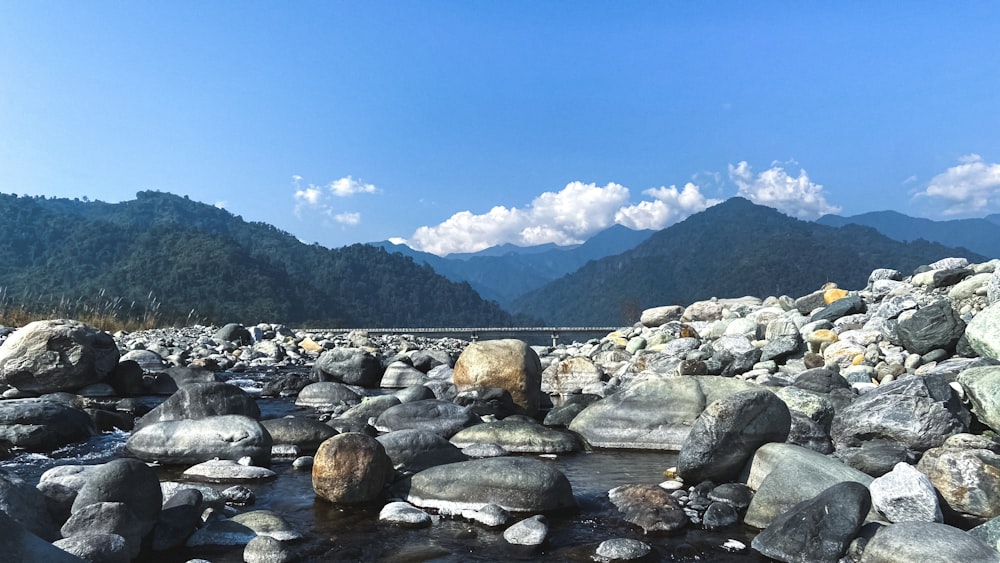 gray rocks on river during daytime