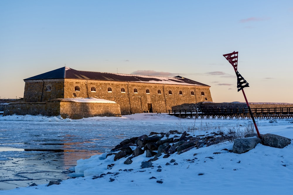 brown concrete building near body of water during daytime