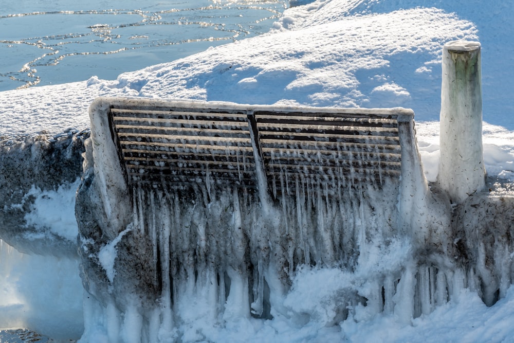 water falls on snow covered ground during daytime