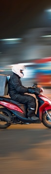 man riding motorcycle on road during daytime