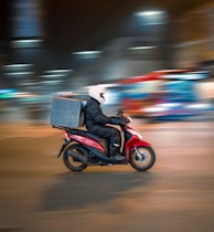 man riding motorcycle on road during daytime