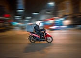 man riding motorcycle on road during daytime