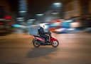 man riding motorcycle on road during daytime
