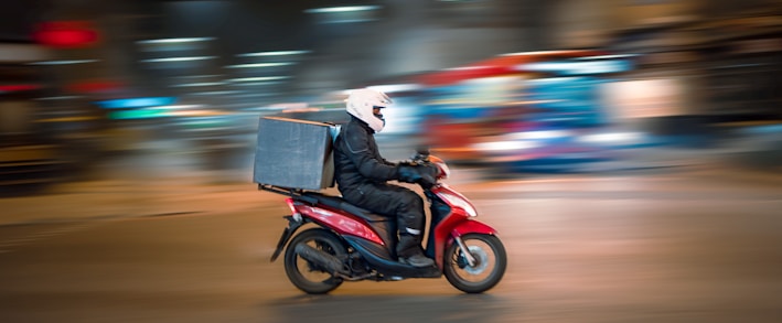 man riding motorcycle on road during daytime