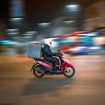 man riding motorcycle on road during daytime