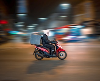 man riding motorcycle on road during daytime