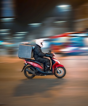 man riding motorcycle on road during daytime