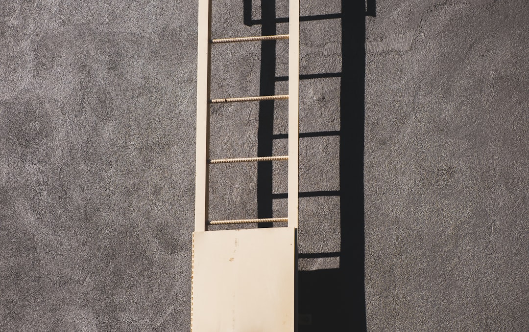 white wooden window frame on gray concrete wall