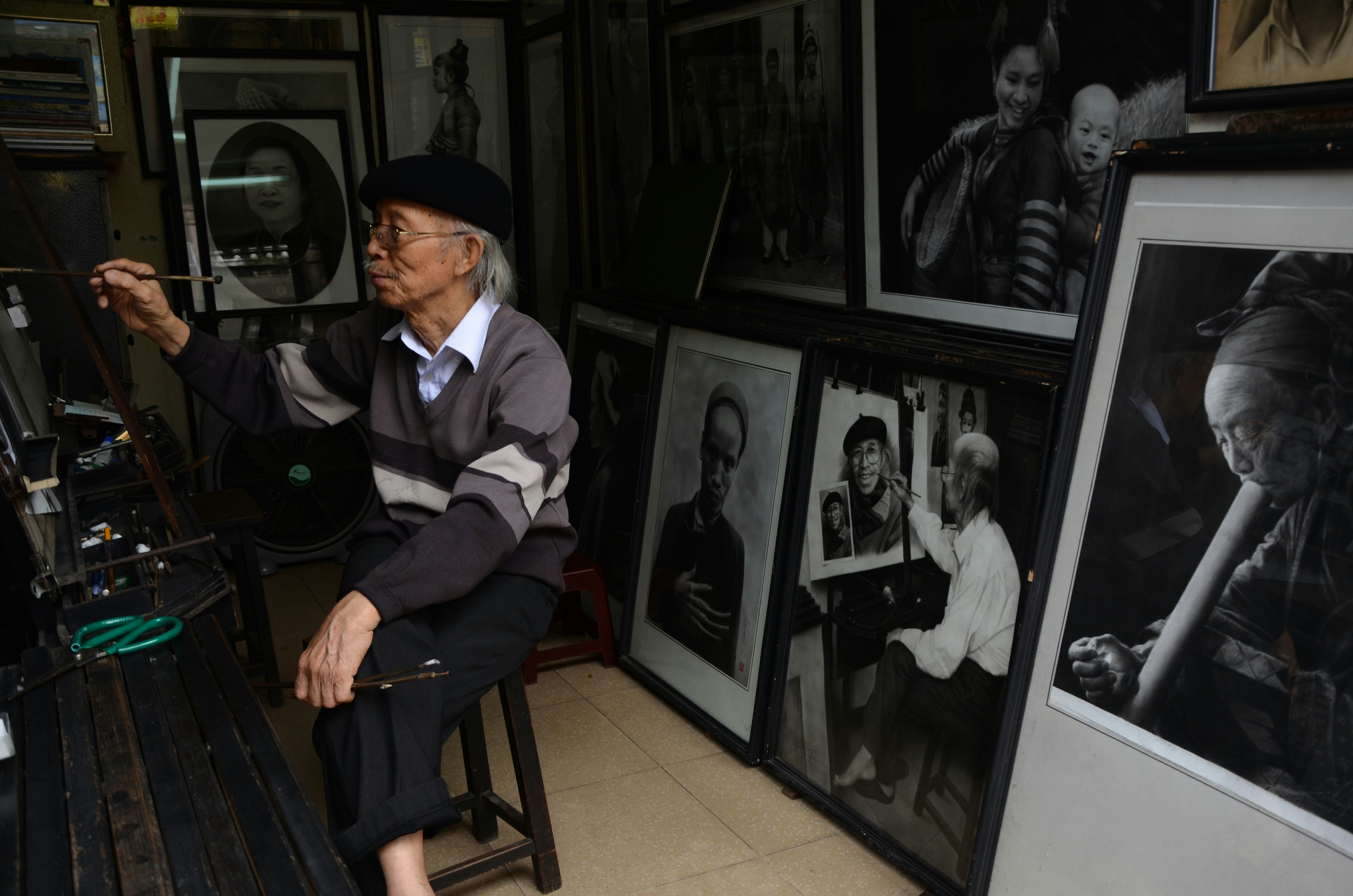 A close-up of an elderly couple, appearing distraught and holding a framed photo of a young man, their eyes reflecting profound sadness.