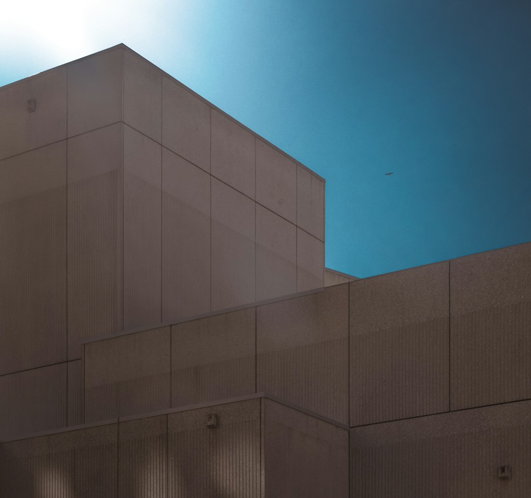 gray concrete building under blue sky during daytime