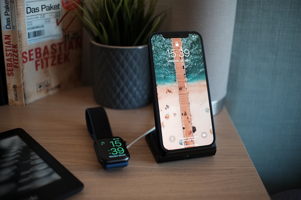 black samsung android smartphone on brown wooden table