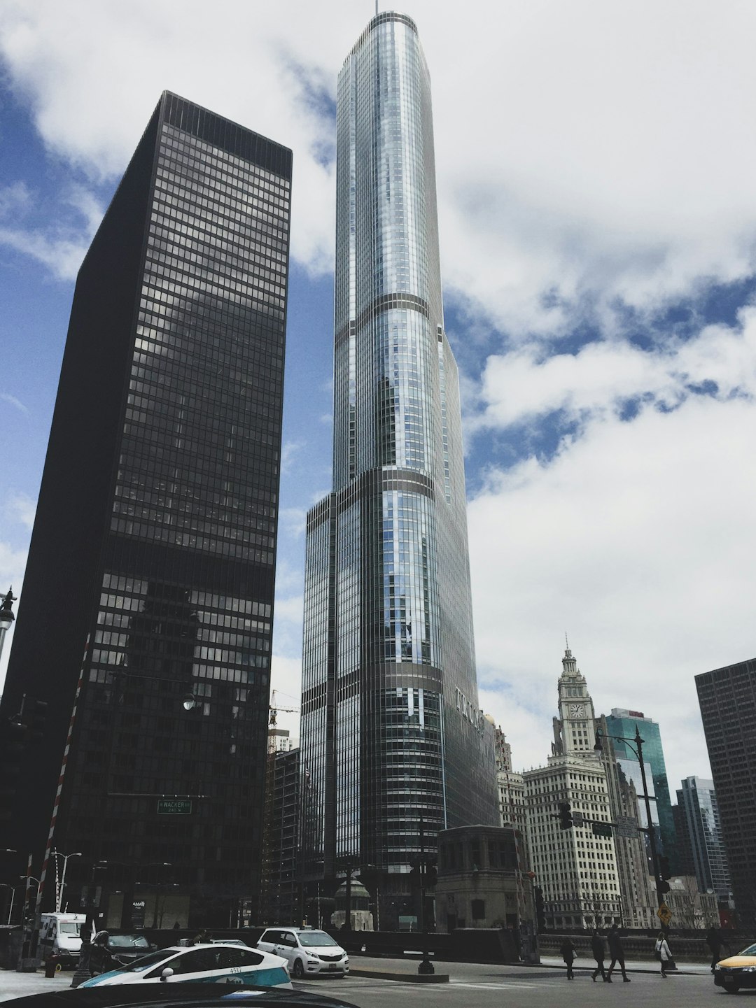 high rise building under white clouds during daytime