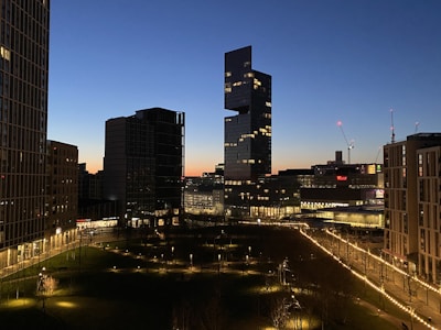 A modern city skyline under twilight, suggesting connected networks.