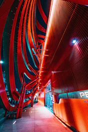 Futuristic smart building facade illuminated with dynamic lighting and digital automation interfaces.