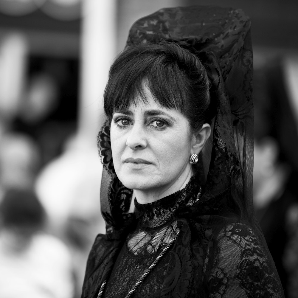 woman in black and white floral dress